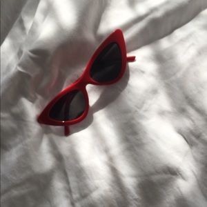 Red sunglasses with black tint